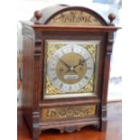 A late Victorian oak mantel clock, eight day movement, quarter repeating, striking on two gongs, the