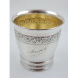 A Swiss silver beaker of tapered cylindrical form, embossed with a band of roses and leaves,