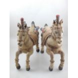 A pair of mid 20th century Sri Lankan carved wood Hindu temple horses, with polychrome painted manes