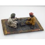 A cold painted Austrian bronze of two North African men playing a game. W. 11cm