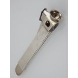 A silver cigar cutter, Mappin & Webb, with an engine turned handle, 3ozt