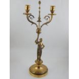 A George III cast silver gilt candelabrum, the twin sconces supported by a Classical maiden in