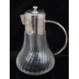 A lemonade jug, the top and handle silver plated, the glass of wrythen design.