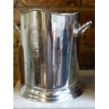 A pair of silver plated twin handled wine coolers, with engraved crests.