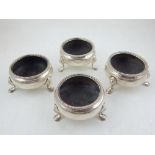 A set of four Victorian silver salts, with gadrooned rims, raised on cast paw feet, London 1841,