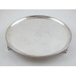 A George III silver card tray of plain circular form,