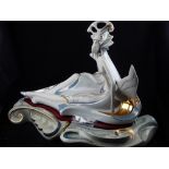 A large Galos limited edition porcelain study of a semi-clad female beside a swan,