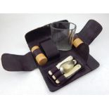 An early 20th century campaign set, the burgundy leather pouch housing a boxwood cruet,