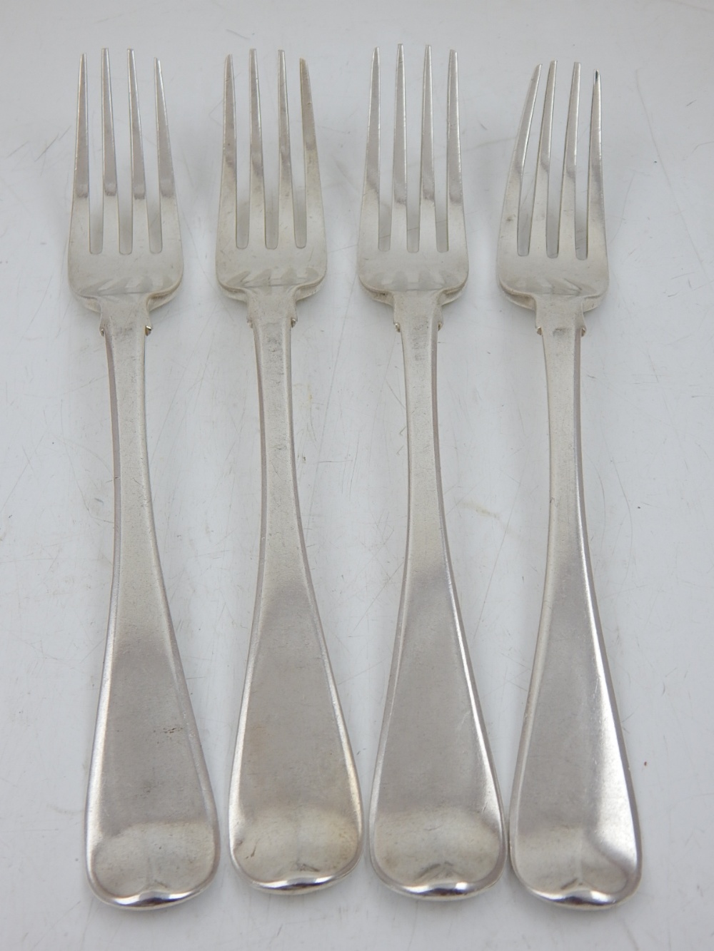 A set of four George III silver table forks, Thomas Wilkes Barker London 1806.