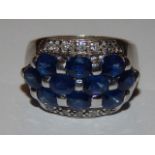 A sapphire and diamond dress ring, with an arrangement of ten stones set in three rows,