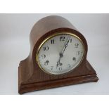 An early 20th century German oak mantel clock the eight day repeating movement with silvered dial