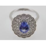 An 18ct white gold tanzanite and diamond cluster ring, approx. 1.9cts.