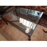A Modern rectangular cast metal glass top coffee table, with X-stretcher. L.