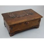 An Arts and Crafts copper mounted rectangular oak Bridge playing card box with hinged top and fall