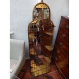 A Victorian style gilt metal arched wall mirror, modelled as a birdcage. H.