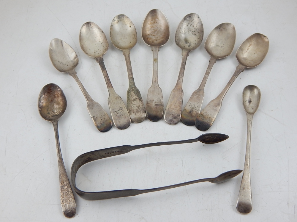 Eight various Georgian silver tea spoons, together with a mustard spoon and a pair of sugar tongs,