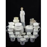 A Lladro porcelain figure of a cherub choir, a Lladro porcelain goose, a Nao figure, a Belleek vase,