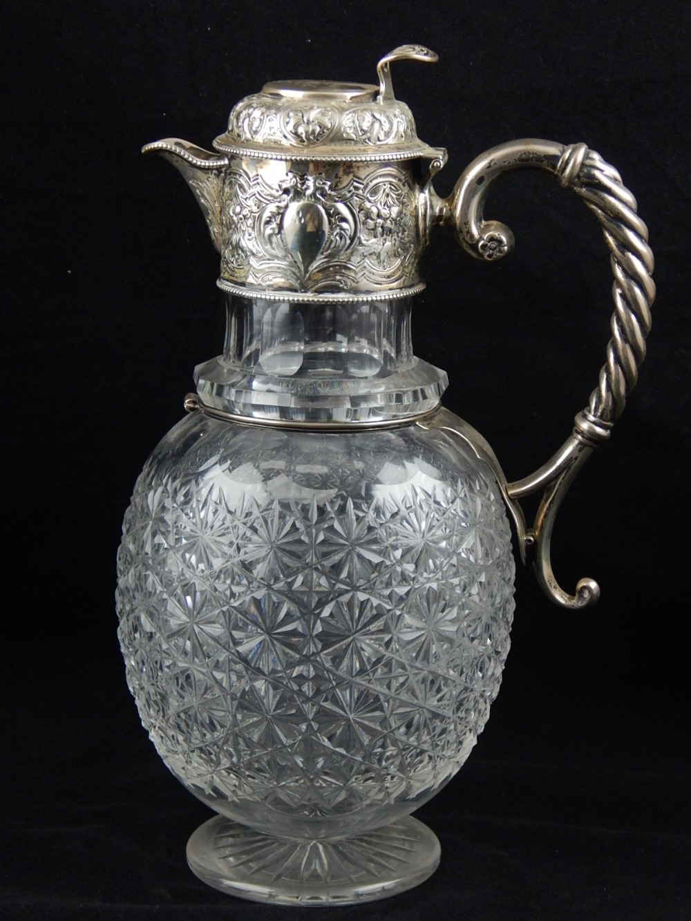 A silver mounted and cut glass decanter, Sheffield 1886, the cap,
