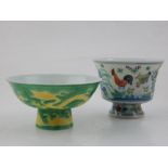 A Chinese doucai tea bowl, decorated with chickens amongst flowers,