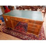 A George I design feather banded walnut pedestal partners desk,