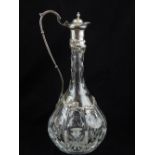 A modern Victorian style silver mounted cut glass claret jug,