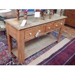 A Victorian style pine three drawer pot board dresser base. W.