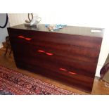 Heals, London, a Slice style oak four drawer chest, with divided interior and red exterior detail.