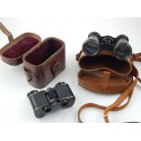 A pair of early 20th century Karl Zeiss Teleater opera glasses, tan leather cased,