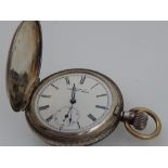 A Victorian silver full hunter pocket watch, the white enamel dial with Roman numerals,