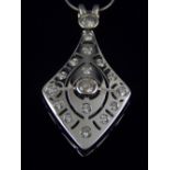 An 18 carat white gold and diamond set kite-shaped pendant,