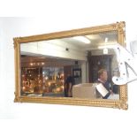 A Victorian giltwood and gesso rectangular overmantle mirror,