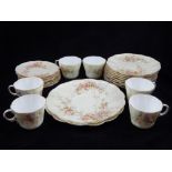 A Royal Worcester tea service, floral decorated on a blush ground,