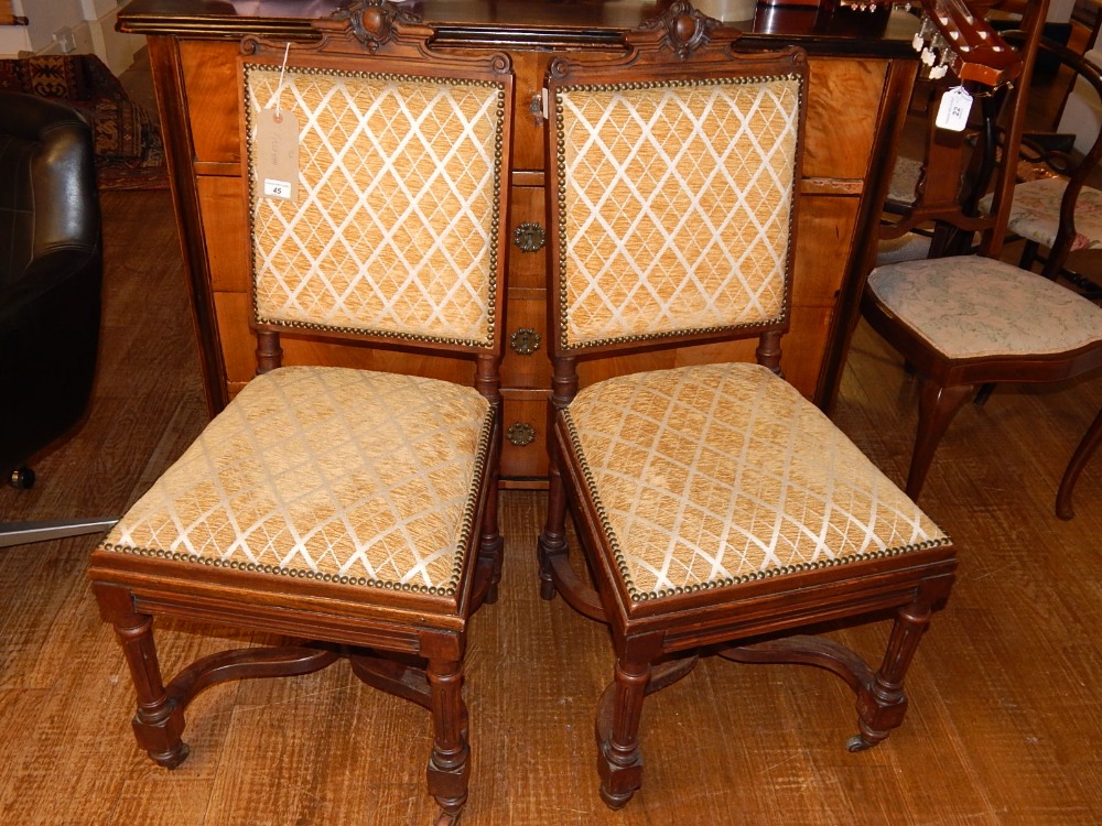 A pair of late 19th century carved walnut side chairs,