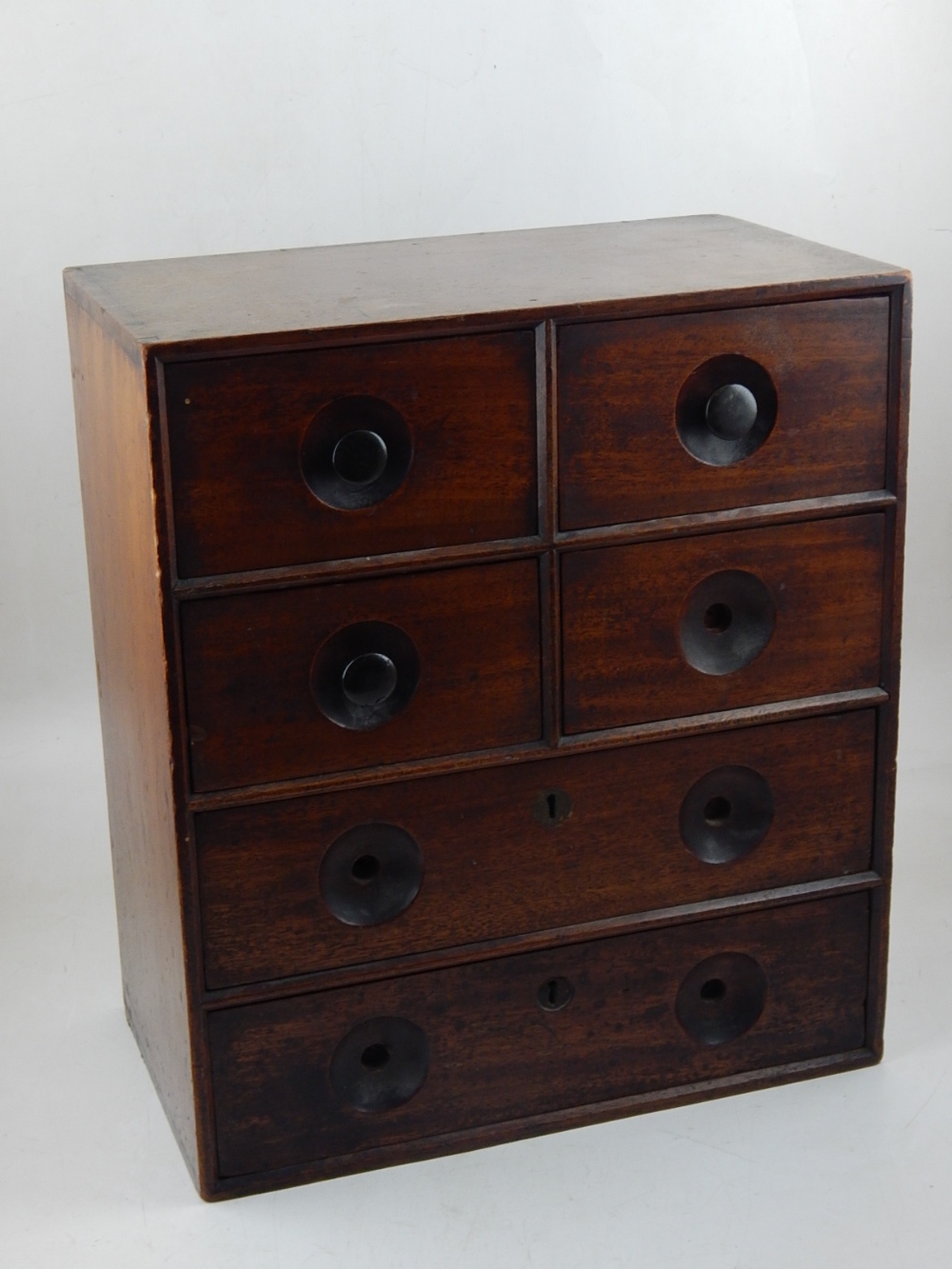 A Victorian mahogany Apothacary chest fitted with an arrangement of six drawers,