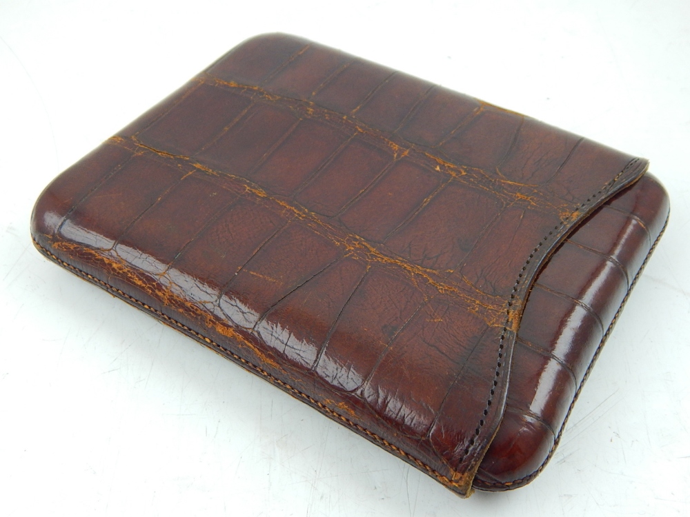 An early 20th century crocodile skin cigar case, beard Drew and Son retail mark.