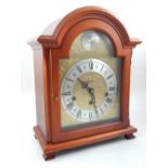 A German reproduction bracket clock, eight day striking movement, gilt dial, silvered chapter ring