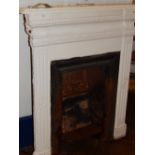 A late 19th century cast iron fire surround and grate, W. 94cm.