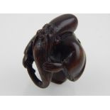 A Japanese Meiji carved boxwood netsuke, modelled as long bearded sage, bear character mark. H. 4cm