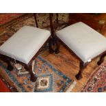 A pair George III style stools, the rectangular oatmeal fabric upholstered seats on cabriole legs