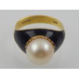 A cultured pearl dress ring, in black enamel, with 18ct yellow gold band.