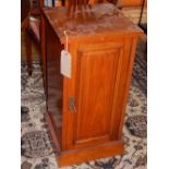 A Victorian walnut bedside cabinet.