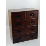 A Victorian mahogany Apothecary chest fitted with an arrangement of six drawers, some with turned