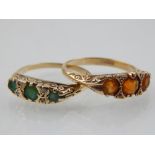 A 9 carat yellow gold and three stone emerald green, together with a 9 carat yellow gold and three