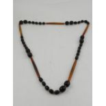 A horn beaded necklace.