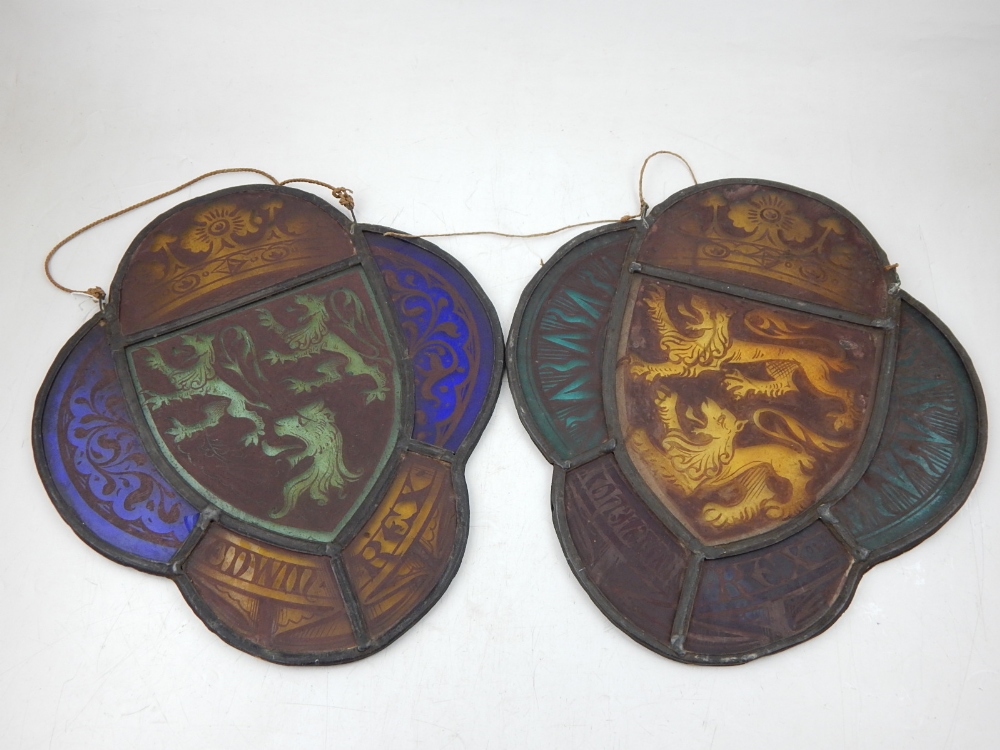 A pair of Victorian stained leaded glass armorials of lobed oval form, each etched with crowns