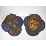 A pair of Victorian stained leaded glass armorials of lobed oval form, each etched with crowns