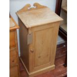 A Victorian pine bedside cabinet.