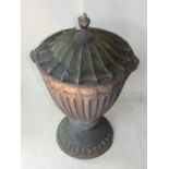 A 19th century lead ornamental garden urn with scalloped cover and fluted body incorporating swags