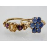 A 9 carat yellow gold and sapphire cabouchon cut cluster ring, together with a 9 carat yellow gold