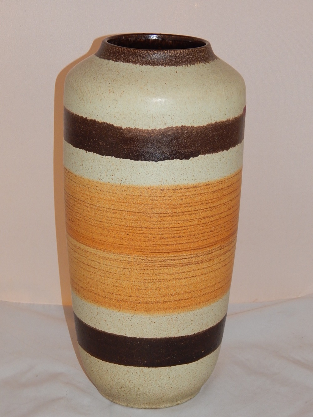 A 1970's West German Scheurich ceramic vase, the cylindrical body with glazed band decoration. H.